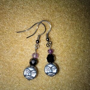 Silver and black face drop earrings